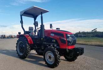 a red 40HP/4wd tractor with a canopy over it