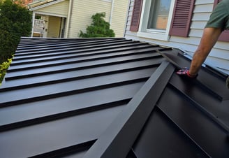 Roofing professional performing emergency metal roof repair after storm damage
