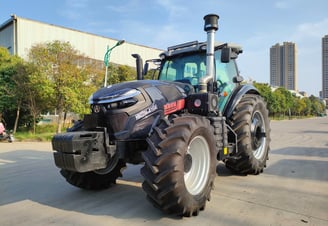 a tractor with a large tire on the side of the road
