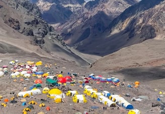 a mountain scene with tents and tents and tents