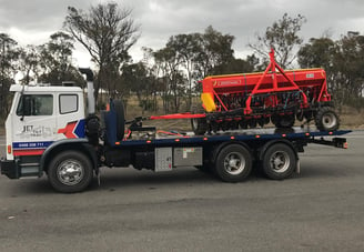 towing agricultural implements using a special hitch tool