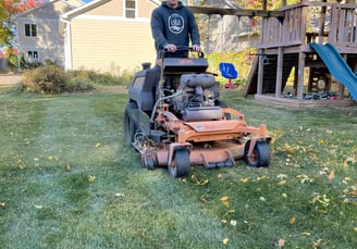 oja-lawn-and-landscape-employee-on-a-mower.jpg
