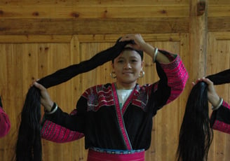 traditional long haired women at Huangluo Yao Village, China