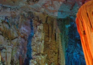 Tracey Billington at the colourful Reed Flute Caves, Guilin, China