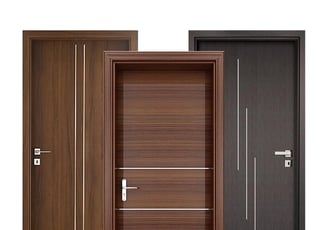 a set of three doors with a wooden flush door