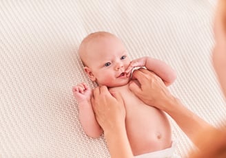 a baby is being held by a woman