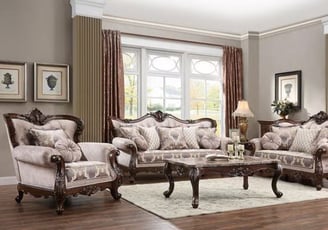 a living room with a couch and chairs