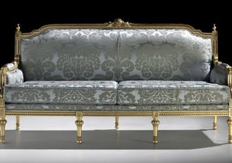 a couch with a gold and silver colored couch