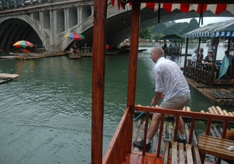 Nick Billington having a water fight at the  Yulonghe scenic area, near Yangshuo, China