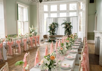 a long table with a bunch of flowers on it