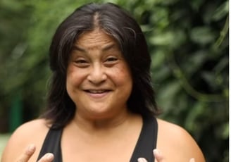 a woman with a black top and a black top