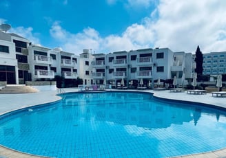 a swimming pool and lounge chairs in Cyprus