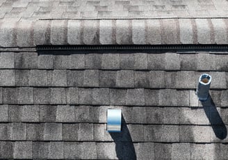 Close-up drone photo of a rooftop in Bartow, Florida, showing hurricane damage for insurance purpose