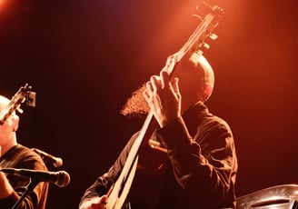 a man playing a guitar 