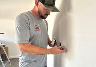 Handyman Replacing Electrical Outlet