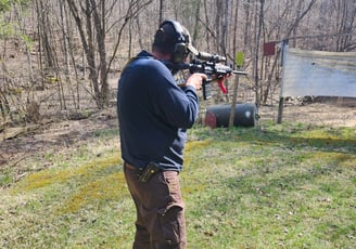 Man using self-defense firearm (Carbine) on range.