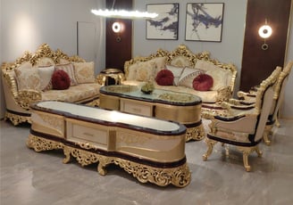 a luxury living room with a solid wood carving couch and a solid wood carving coffee table