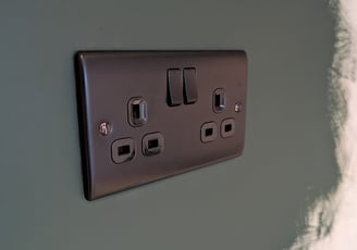 a black and white electrical outlet in a wall