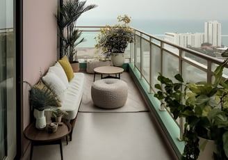 a balcony with a couch and a table