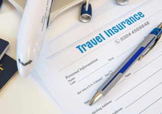 a pen on travel insurance paper