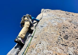 Hand jamming on Spigolo Vinci, Pizzo Cengalo. Valmasino, Italy