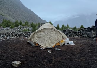 A white tent in the mountains