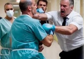 a doctor wearing a scrub attaccked by a patient in the hospital