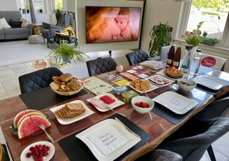 a table with plates of food and drinks