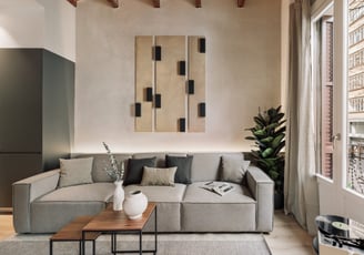 Contemporary Living room with custom art panels, minimalist furniture, neutral tones interior design