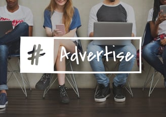 a group of people sitting on chairs with a hash advertise