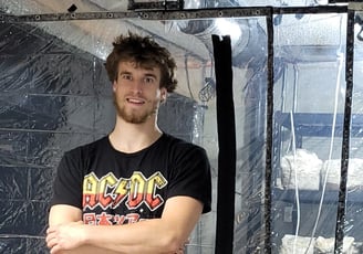 Jordan Clark with his mushroom cultivation tents before expansion.