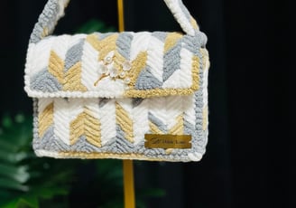 a small purse bag with a yellow and white chevrons