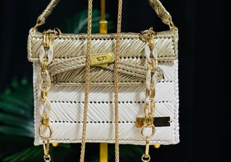 a purse with a chain link chain and a gold chain link