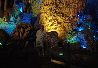 Nick Billington at the colourful Reed Flute Caves, Guilin, China