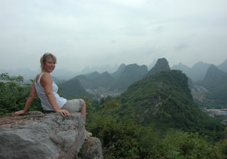 Nick and Tracey Billington climbing the hills above the city of Guilin, China