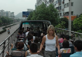 Tracey billington on an open top bus in Guilin, China