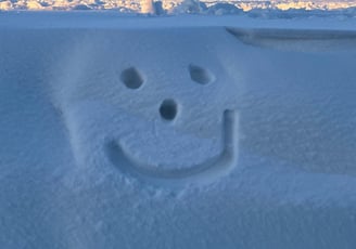 a face in the snow outside the airport, reykjavik, Iceland