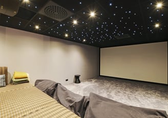 Private cinema room at Villa Bastille with full-width screen