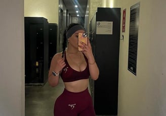 KF Women's burgundy strapped sports bra and burgundy leggings