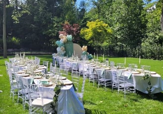 Table setting for 60 people with a balloon backdrop