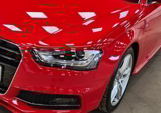 a red car parked in a garage