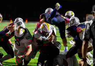a group of people playing a game of football