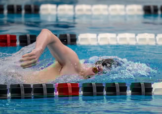 a swimmer in a swimming pool with a lot of water