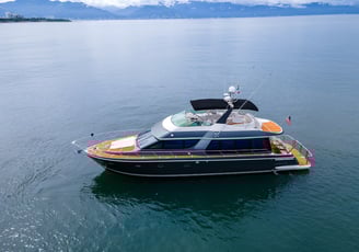 a luxury boat in the water with a flag on it