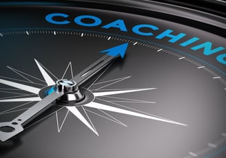 a compass - shaped clock with the words coaching on it