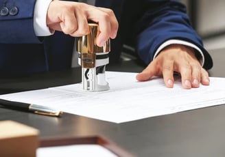 A document is being notarized and stamped for adoption for an adoption by a Notary