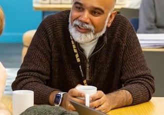 Avi Sinharay chatting holding a cup of tea