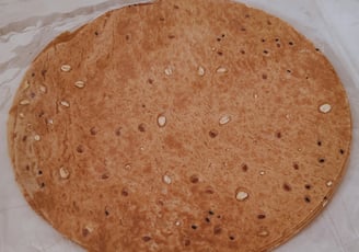 A bag of Whole wheat Saj Bread with Seeds