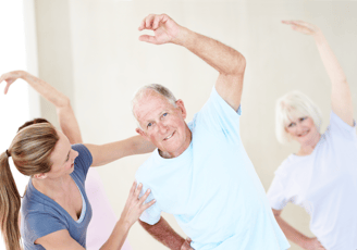 a man and woman doing a yoga class