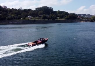 Guests enjoying a James Bond–style ride on Eskrok, a classic speedboat on the Douro River